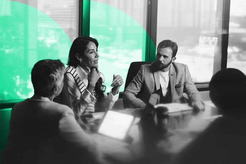 Business professionals collaborating during a meeting around a conference table