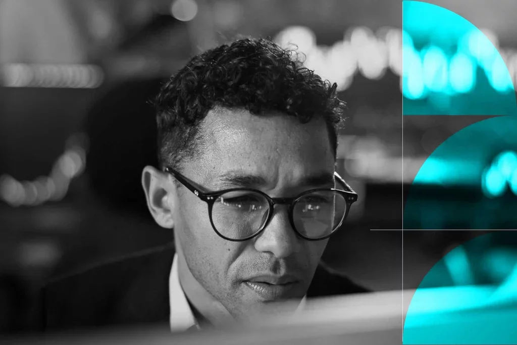 Business professional reviewing information on a computer screen