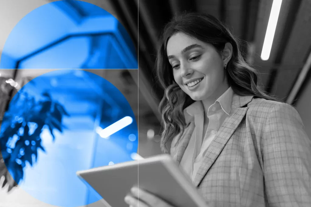 Business professional reviewing information on a tablet in a modern office