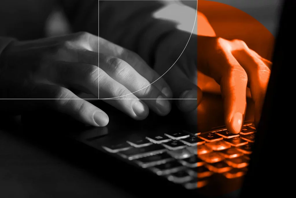Close-up of hands typing on a keyboard, representing third-party cyber risk and threat activity.