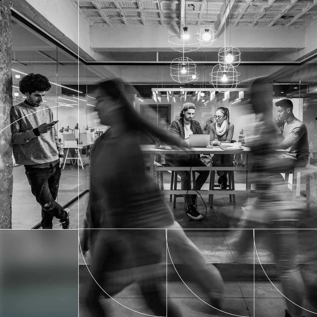 Professionals working together in a busy modern office environment.