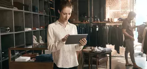 Woman Using iPad Protected by Digital Security Risk Protection