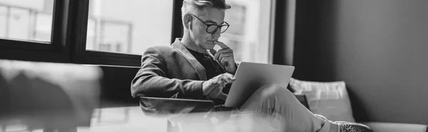 man-looking-at-laptop-screen