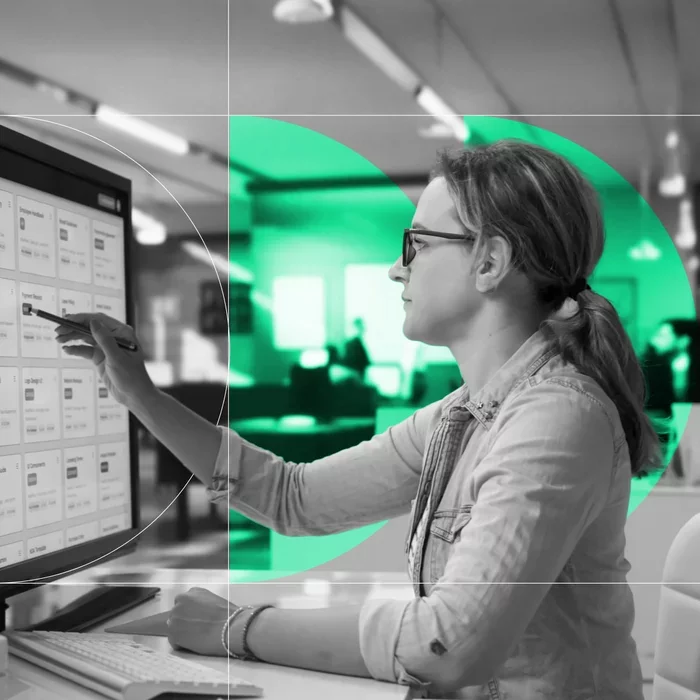 Security professional reviewing risk insights on a computer monitor.