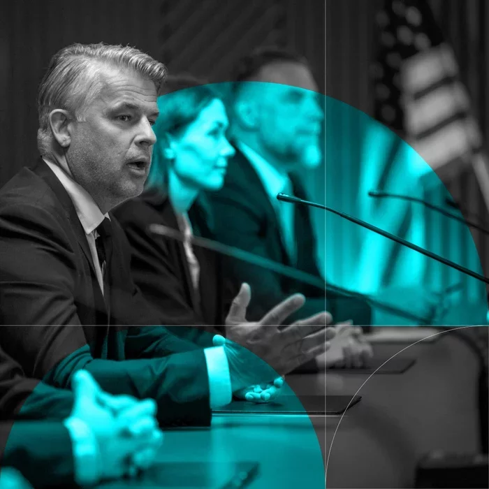 Government officials discuss cybersecurity strategy during a formal meeting