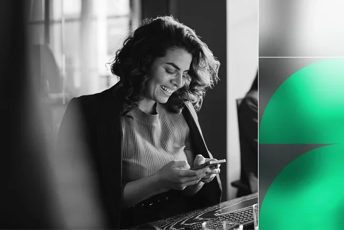 Professional using smartphone, representing secure authentication and account takeover prevention.
