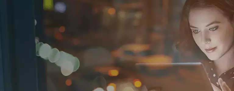 Woman Using iPad Protected by a Cloud Data Protection Service