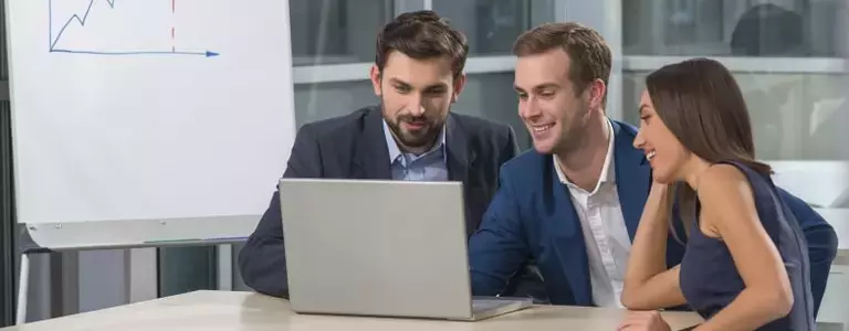 Male Employees Analyse Digital Risk Platform on Laptop