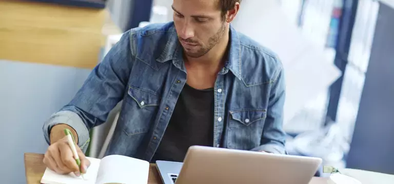 Man Using Laptop Protected by Advanced Threat Protection