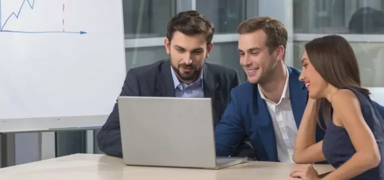 Male Employees Analyse Digital Risk Platform on Laptop