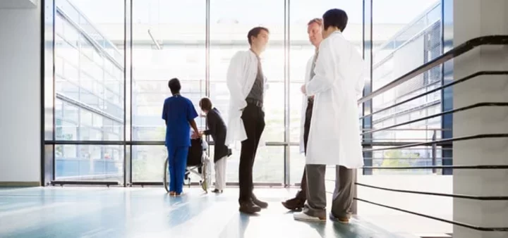 Three Male Physicians Discuss Healthcare Cybersecurity