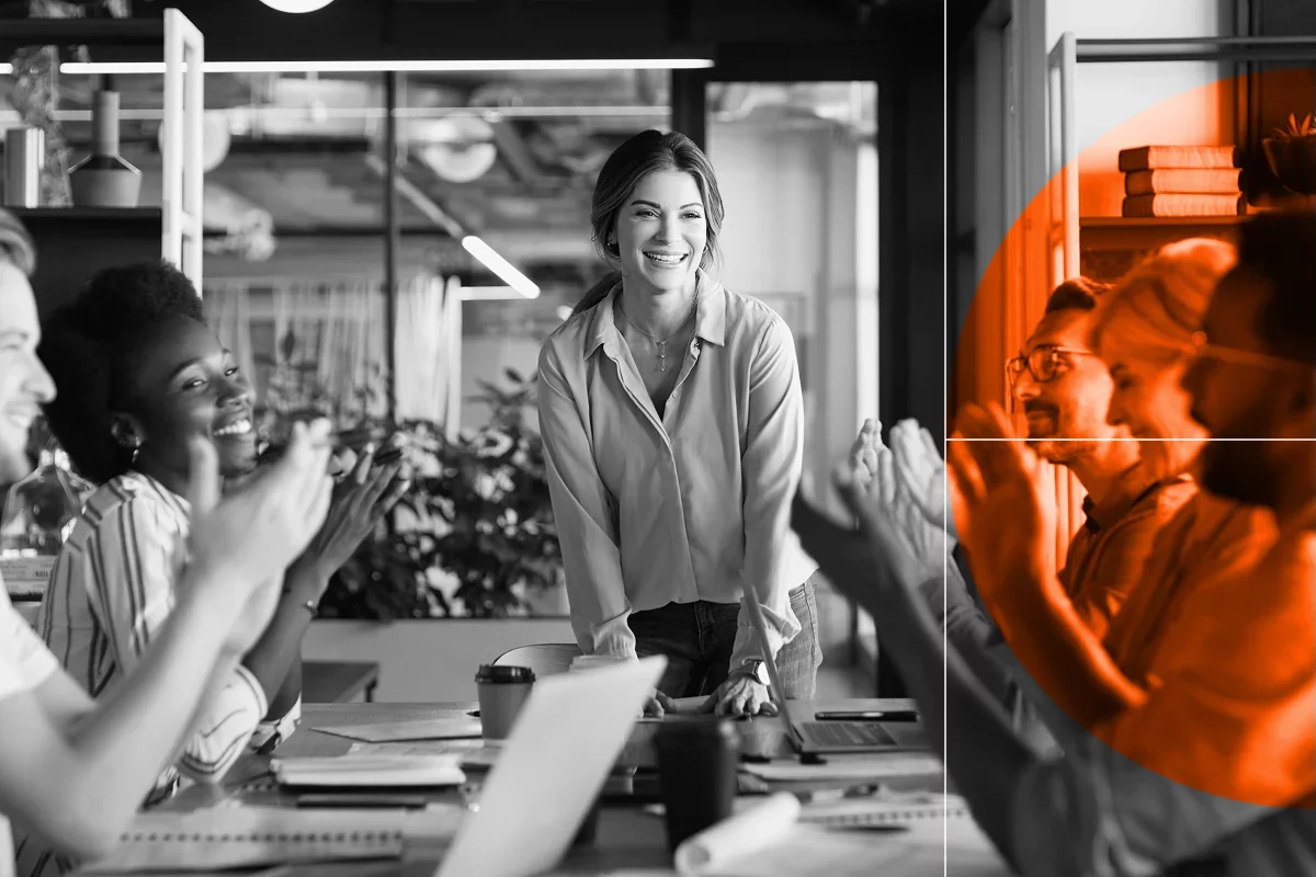 People applauding in a meeting room.