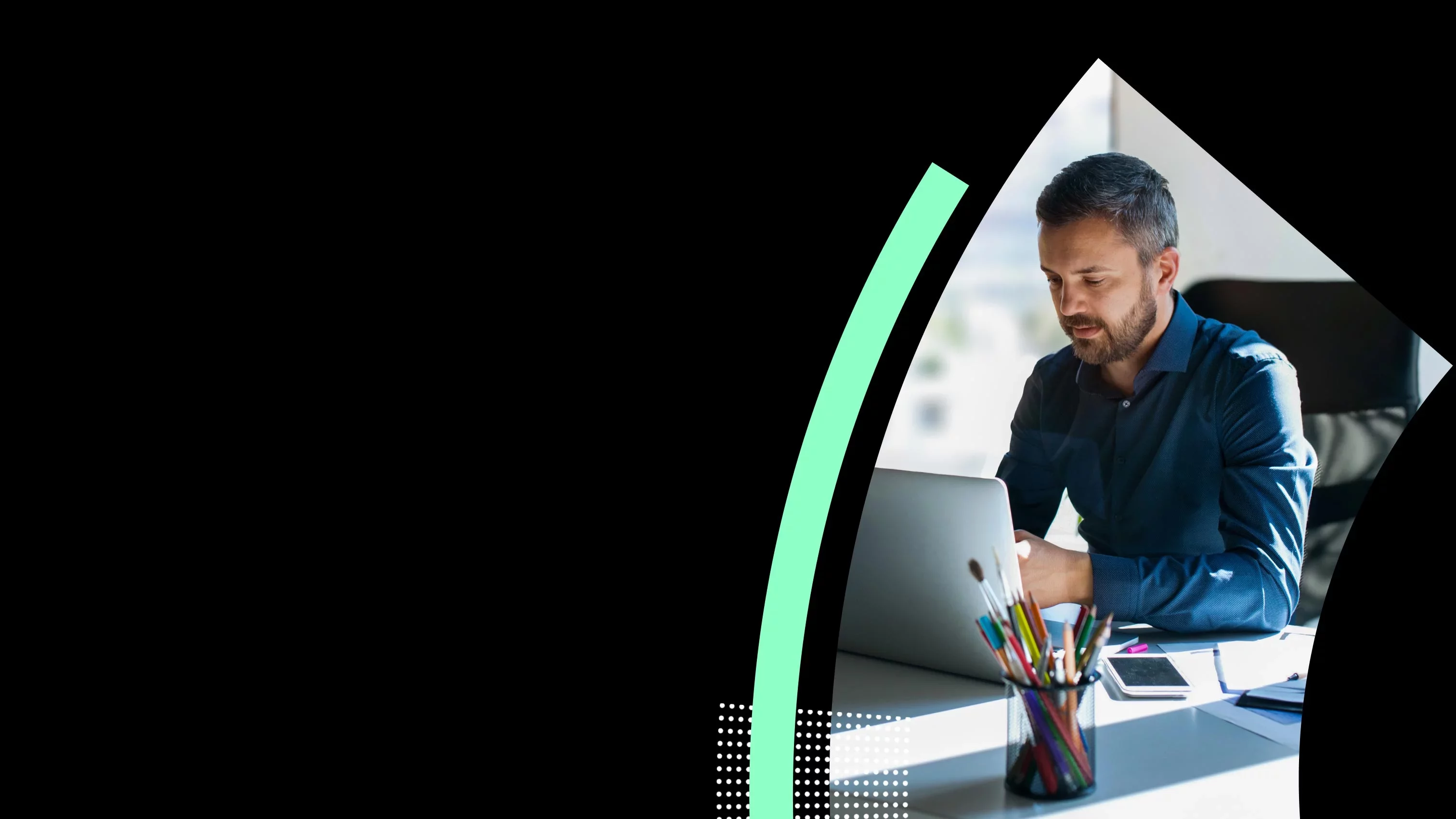 Professional reviewing secure enterprise workflows on laptop at desk.